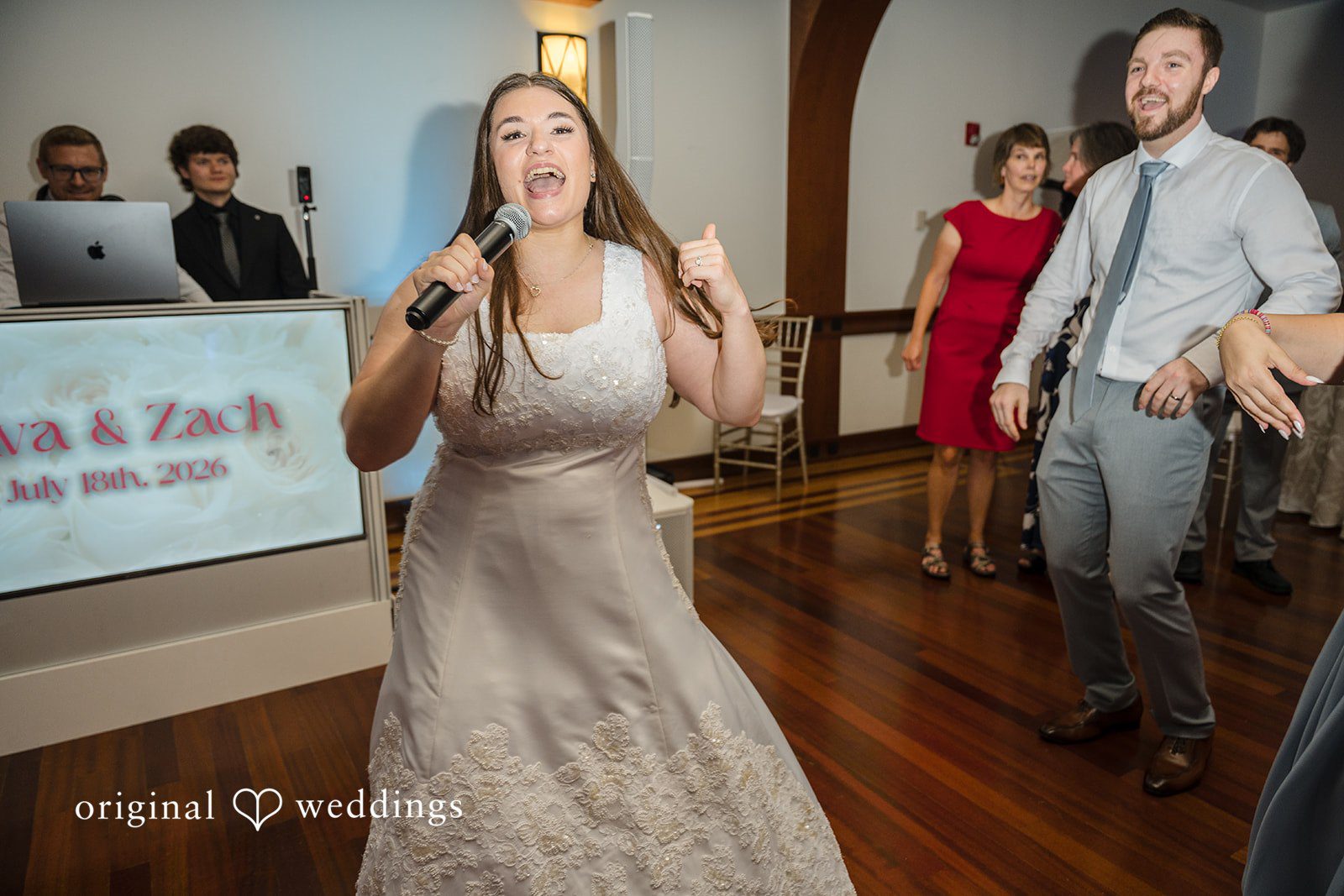Ava + Zach A bride dancing happily during the wedding reception.