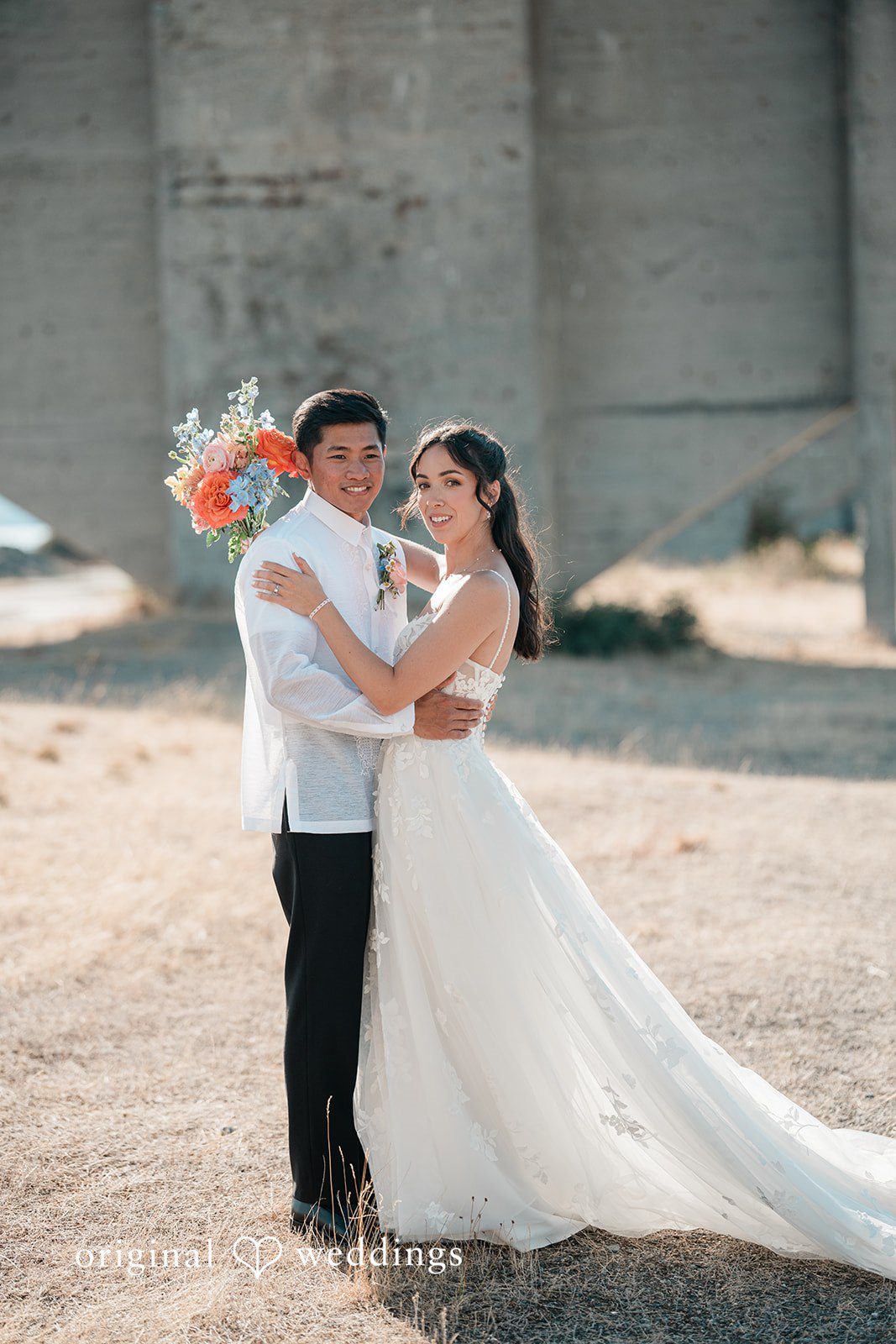 Katie + Gerald Stunning Portrait of couple at Chambers Bay Golf Course by Seattle Wedding Photographers from Original Weddings.