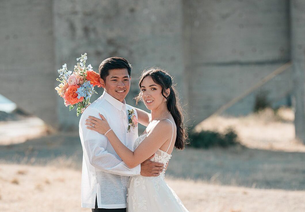 Stunning Portrait of couple at Chambers Bay Golf Course by Seattle Wedding Photographers from Original Weddings.