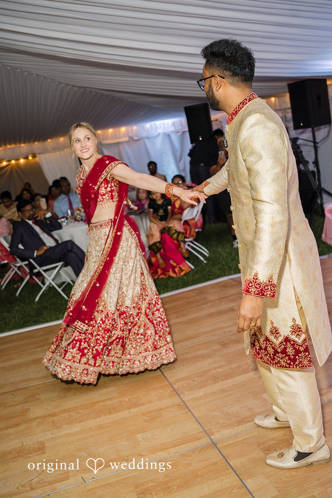 Julie + Joshua A bride and groom performing a traditional dance routine on a dance floor.
