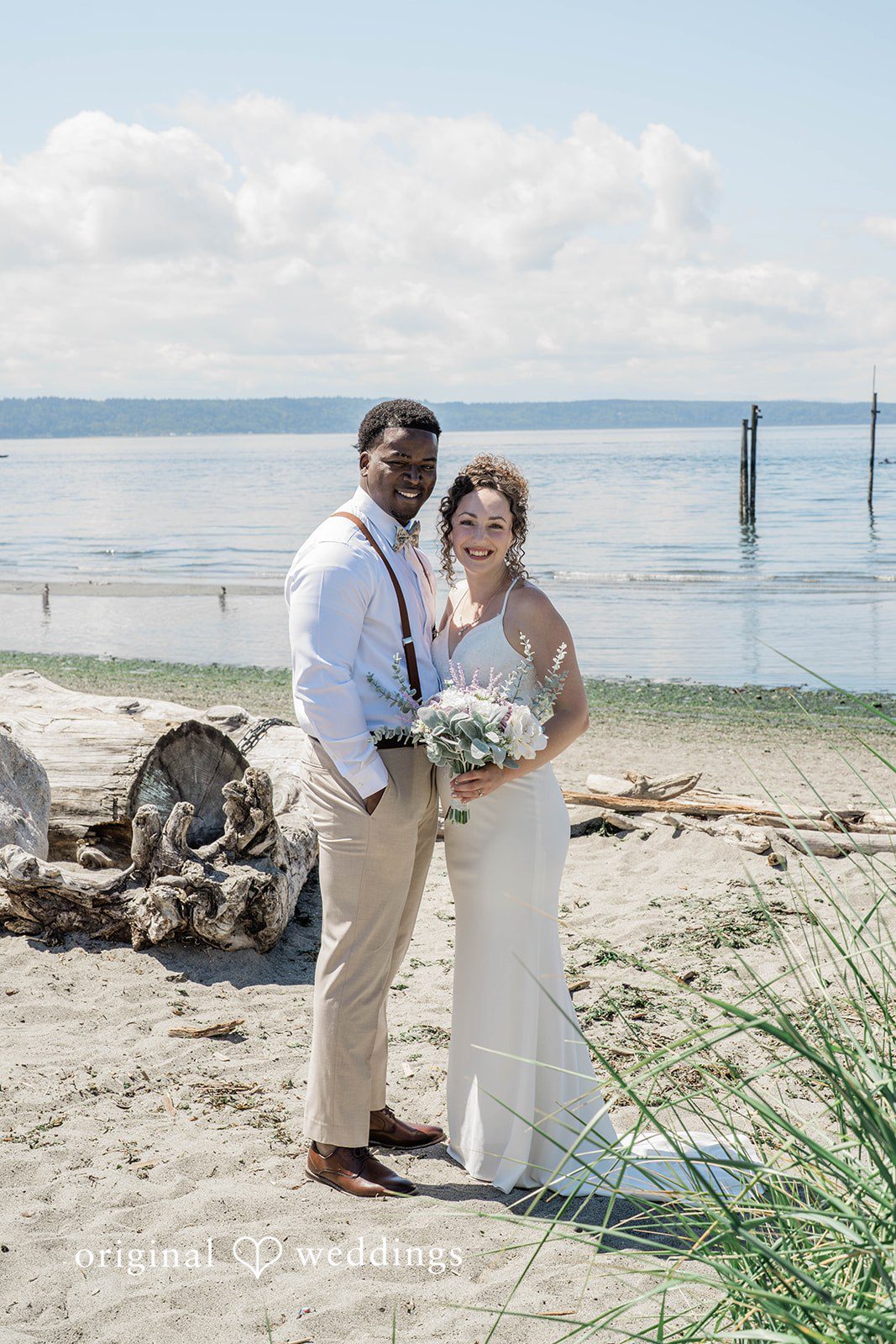 Naomi + Darrell Stunning portrait of couple at Edmonds Waterfront Center by Seattle Wedding Photographers from Original Weddings.