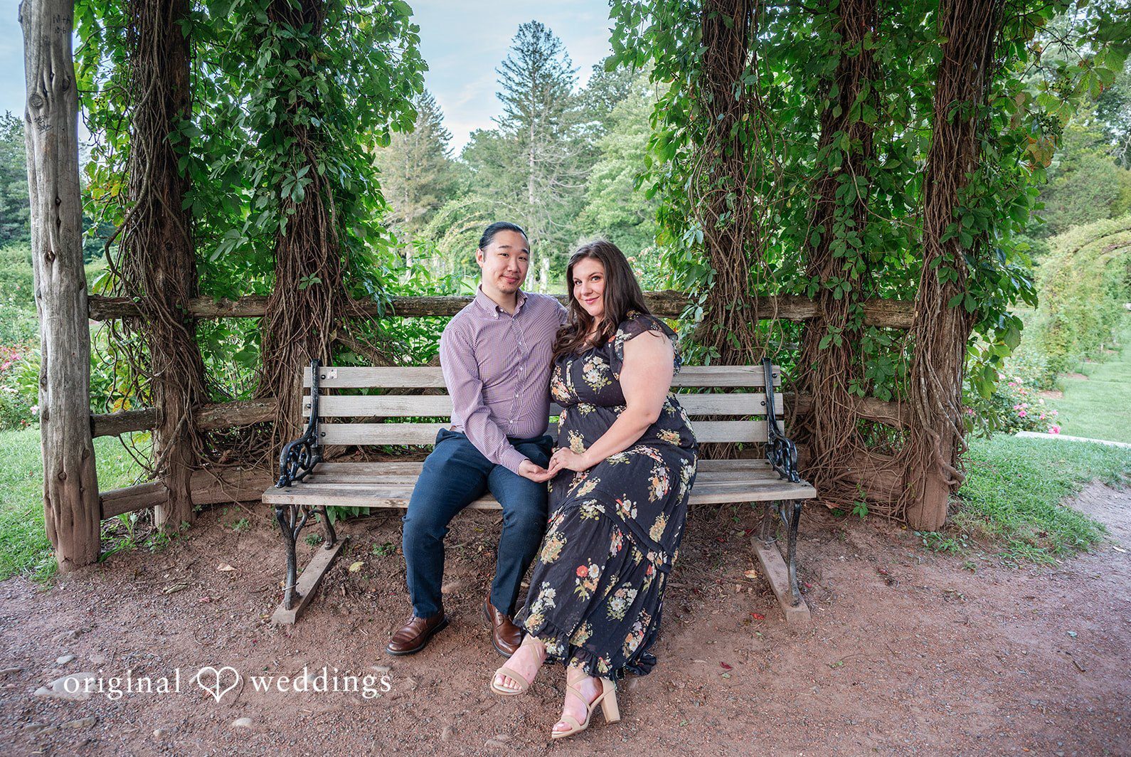Engagement photography services by Original Weddings capturing close-up of couple at Elizabeth Park.