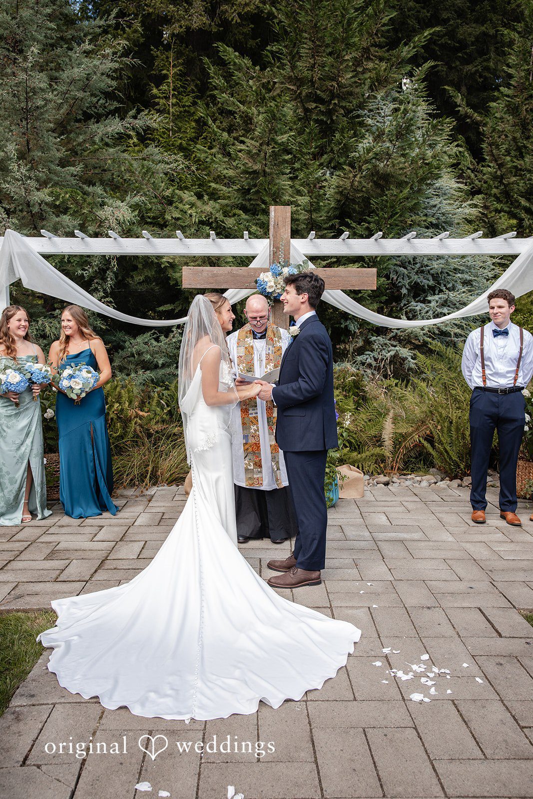 Alissa + Duncan A bride and groom standing together during their wedding ceremony.
