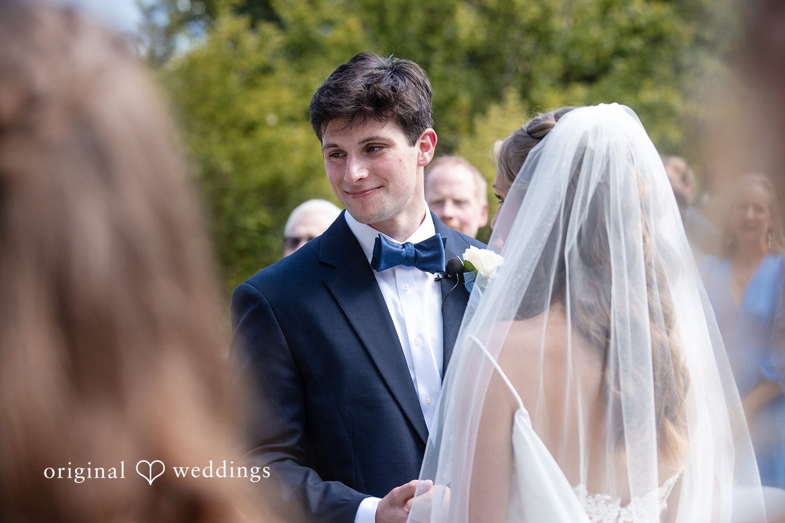 Alissa + Duncan A groom looking towards his bride at the altar during the ceremony.