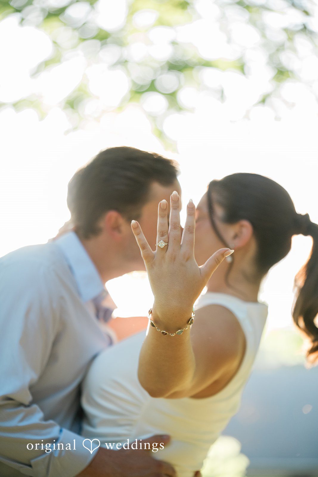 A couple sharing an intimate moment as they lean in close to kiss.