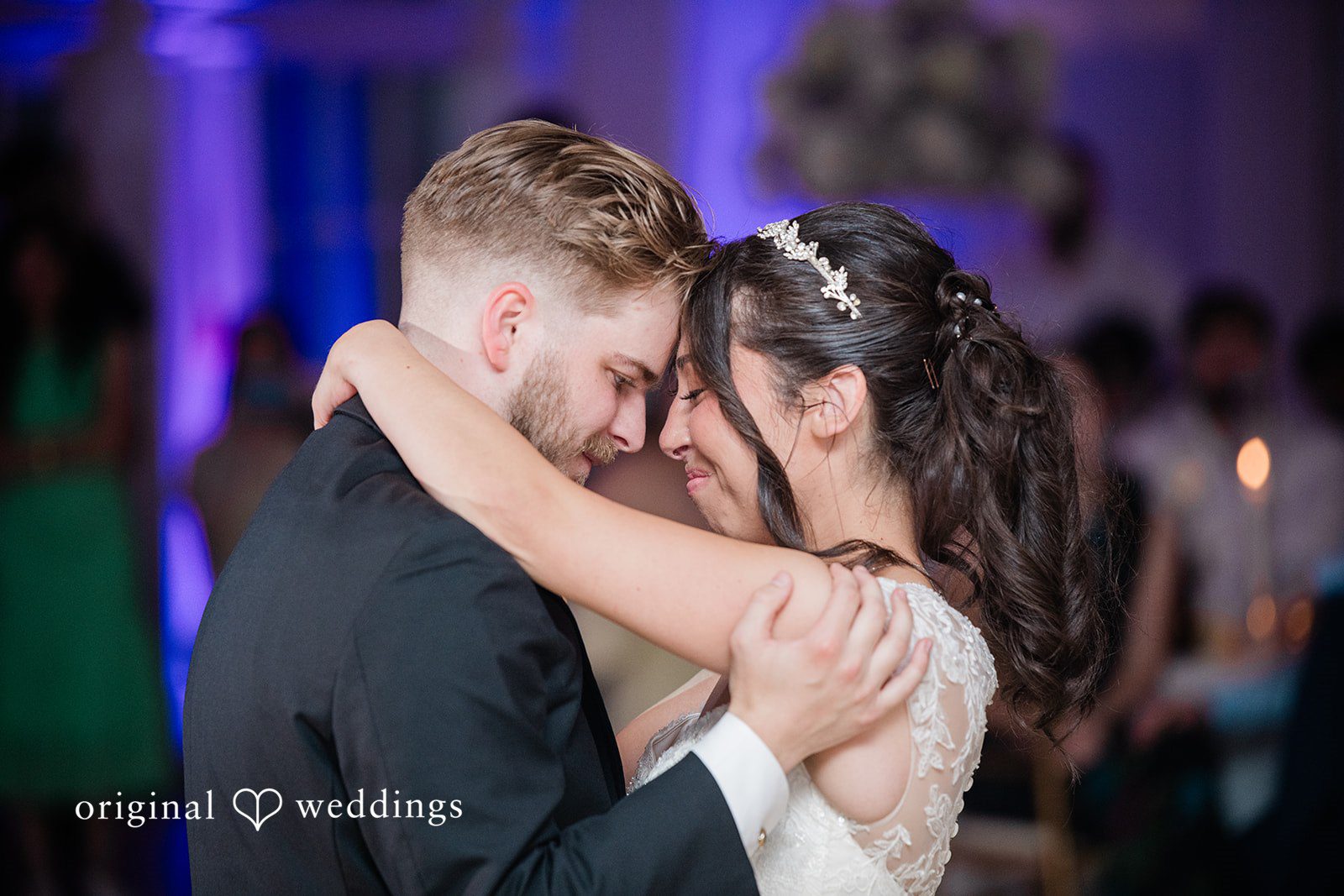 Julia + Camden A groom embraces his bride on the dance floor during their reception.