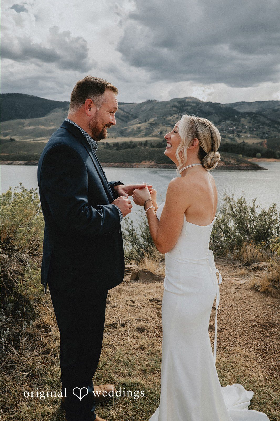 Kelsey + John The bride puts a ring on groom's finger