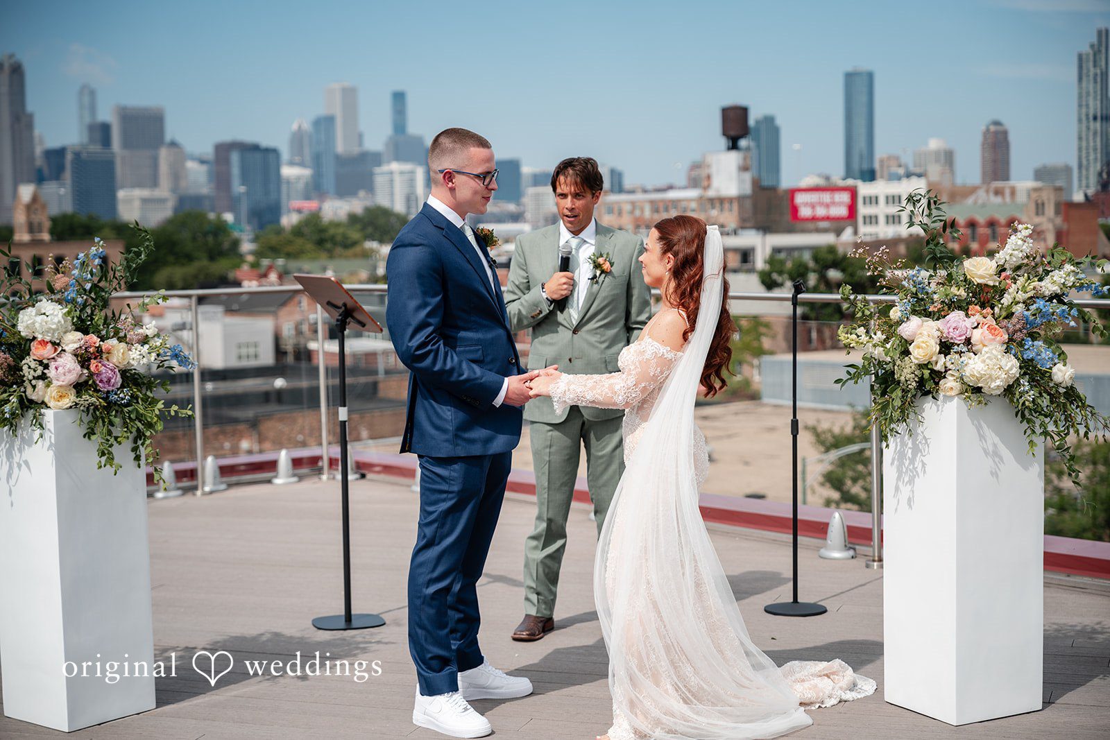 Lucy + Cormac A bride and groom standing during a ceremony on a rooftop.