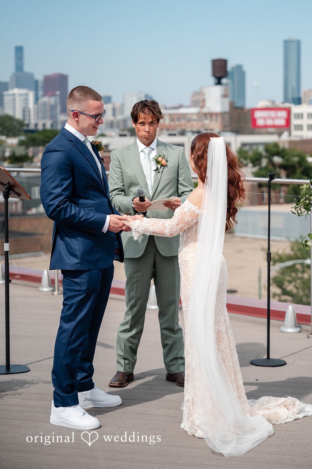 Lucy + Cormac A groom and bride holding hands during a wedding ceremony.