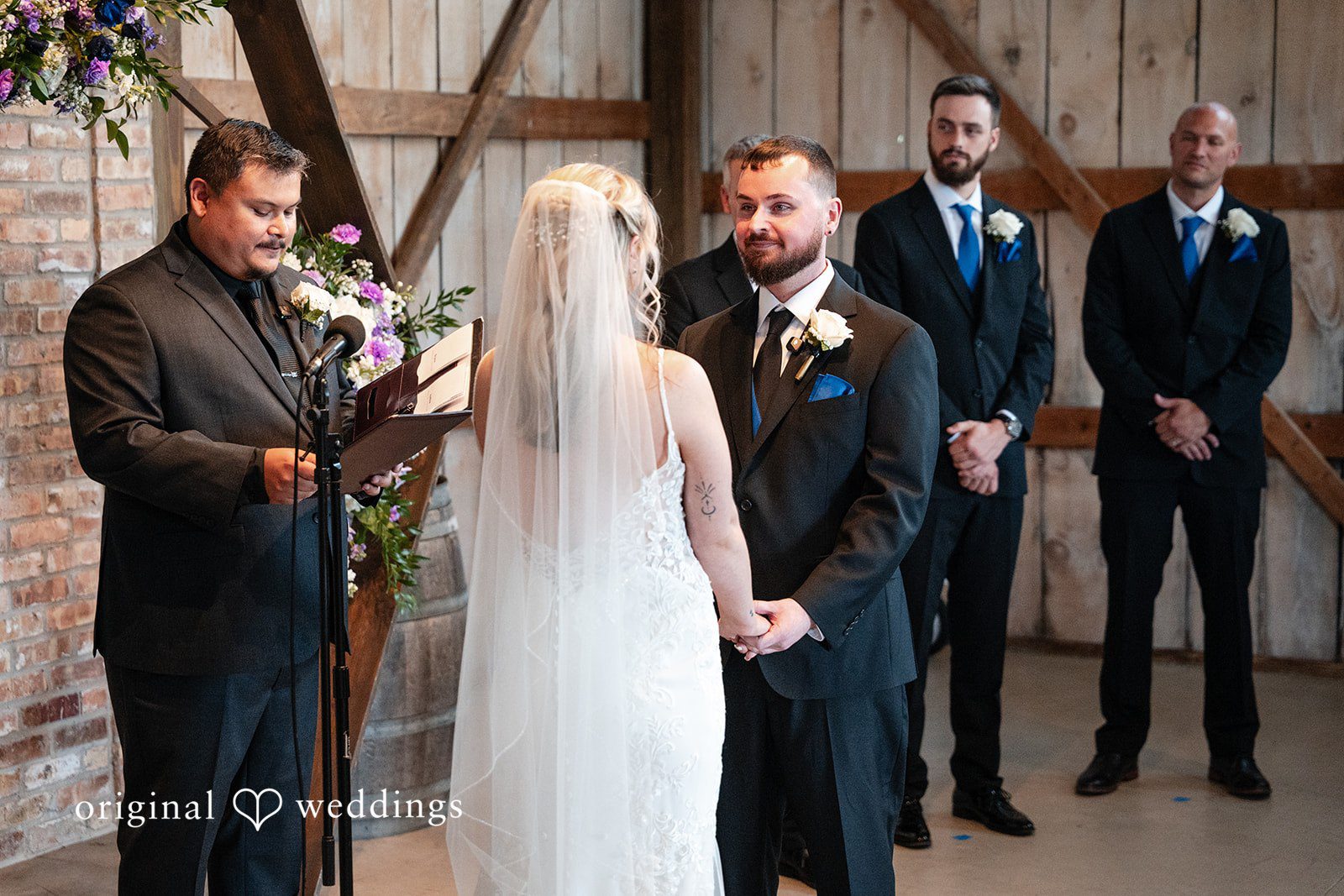 A ceremony in progress viewed from behind the wedding party.