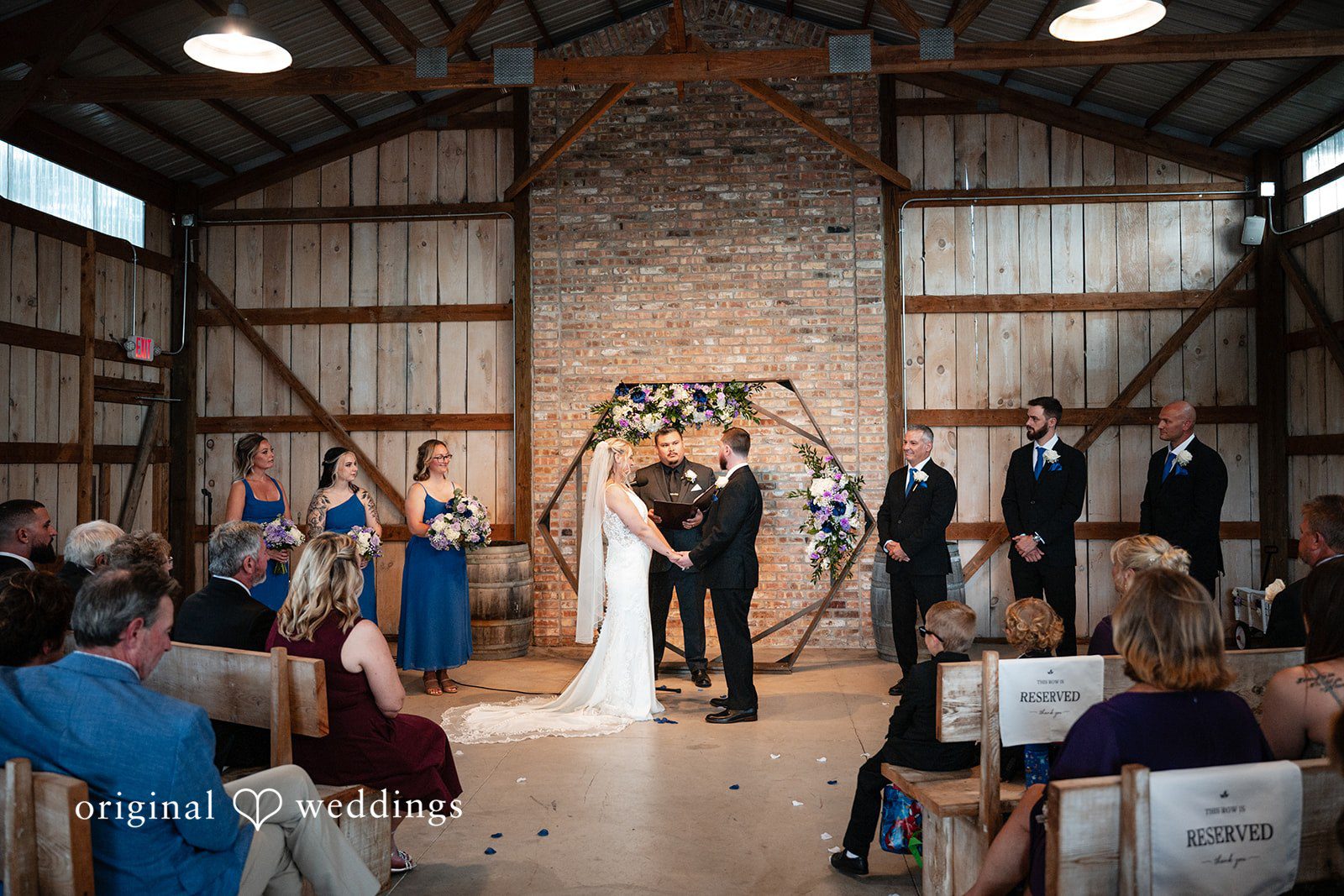 Wide angle view of guests seated for a wedding ceremony.