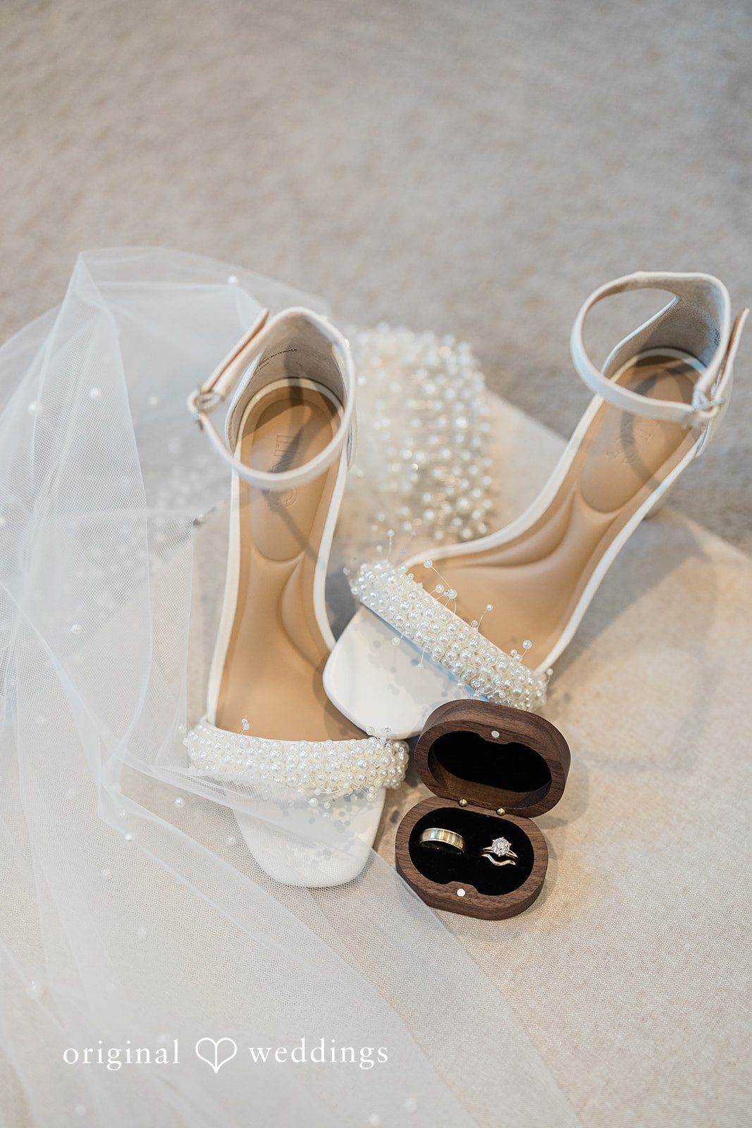 Jennifer + Zac A collection of wedding details including bridal shoes, a wedding ring box, and a perfume bottle.