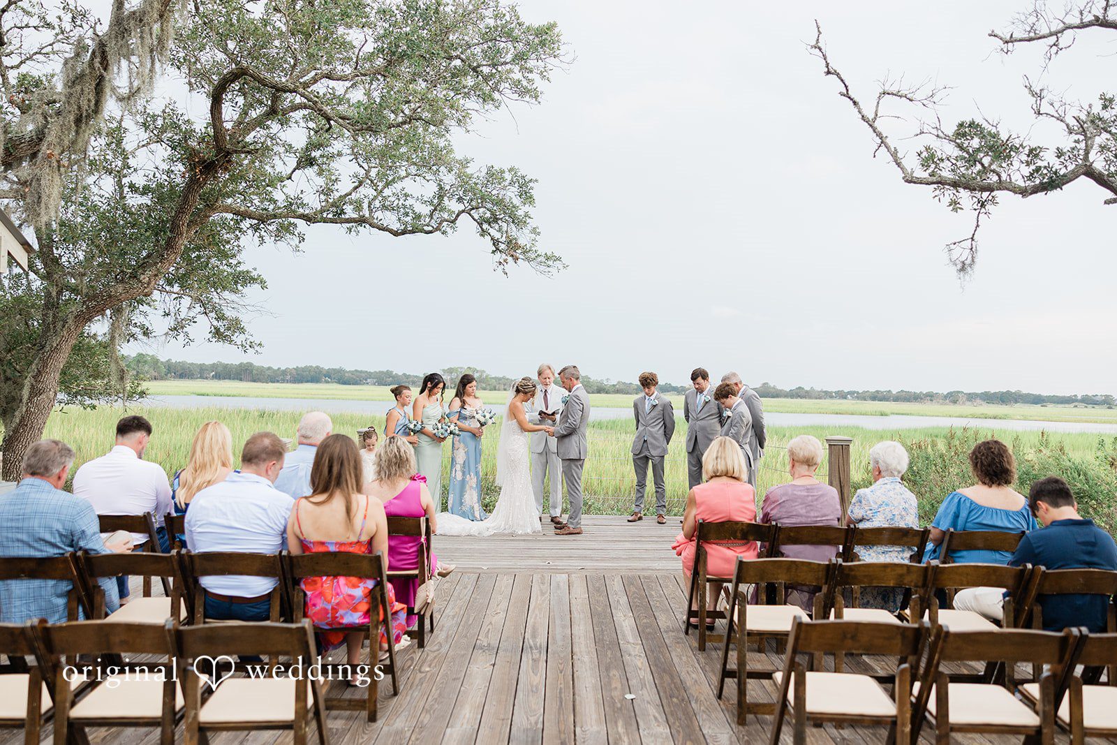 Jennifer + Zac Wedding ceremony with guests seated in rows facing the altar.