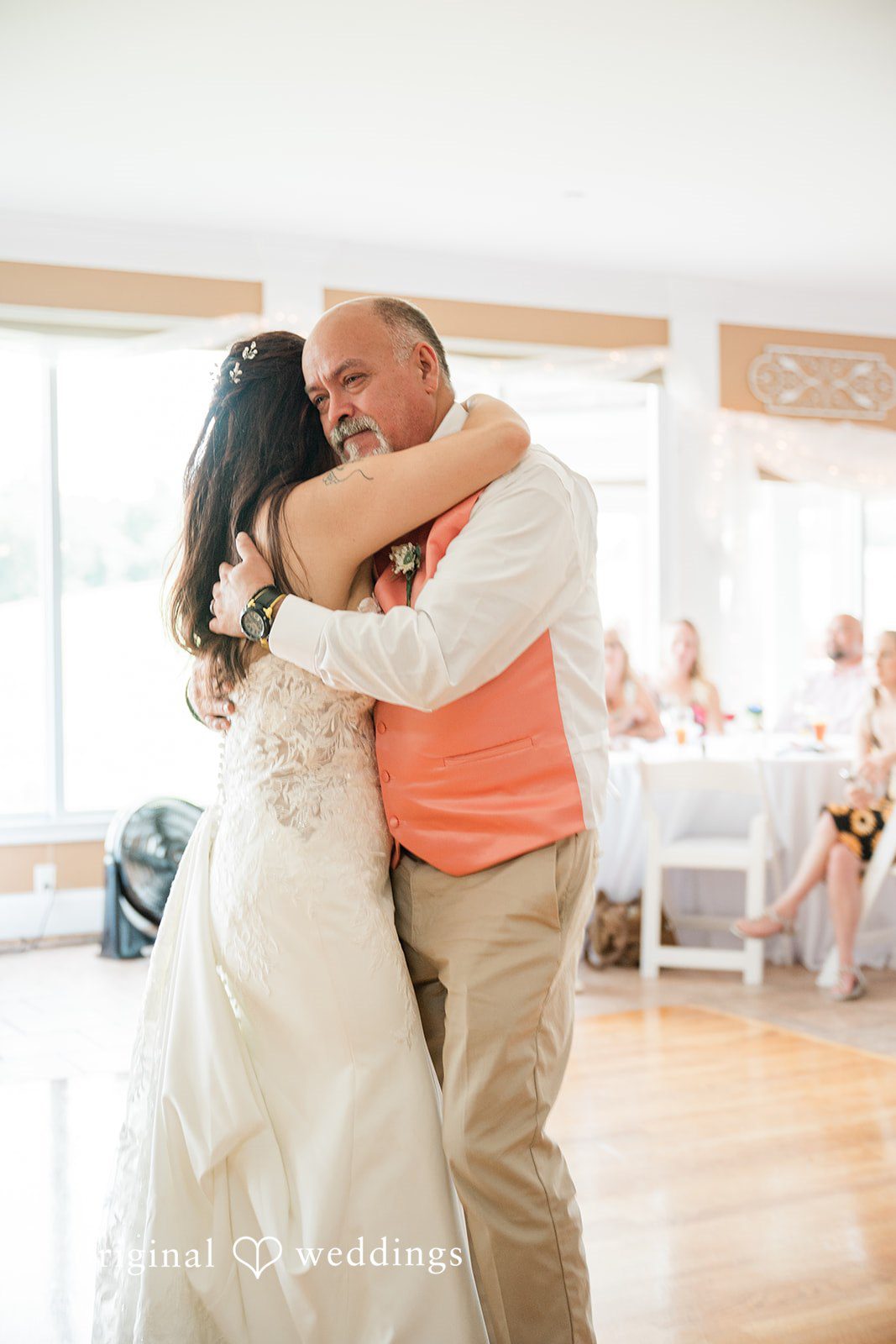 The bride dances with her father