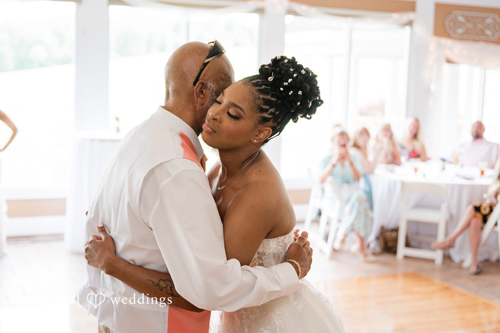 The bride dances with her father