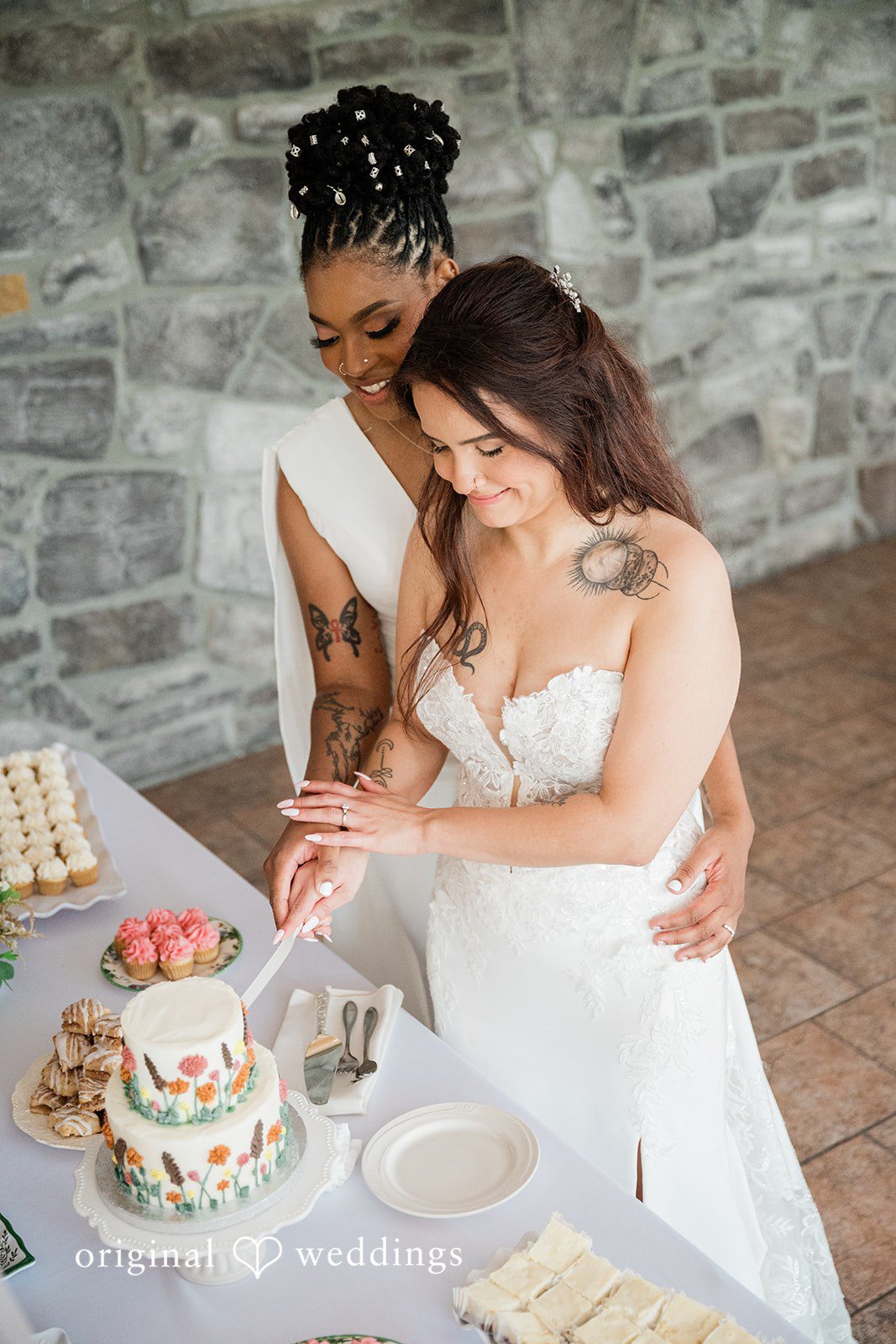 The couple cuts their wedding cake