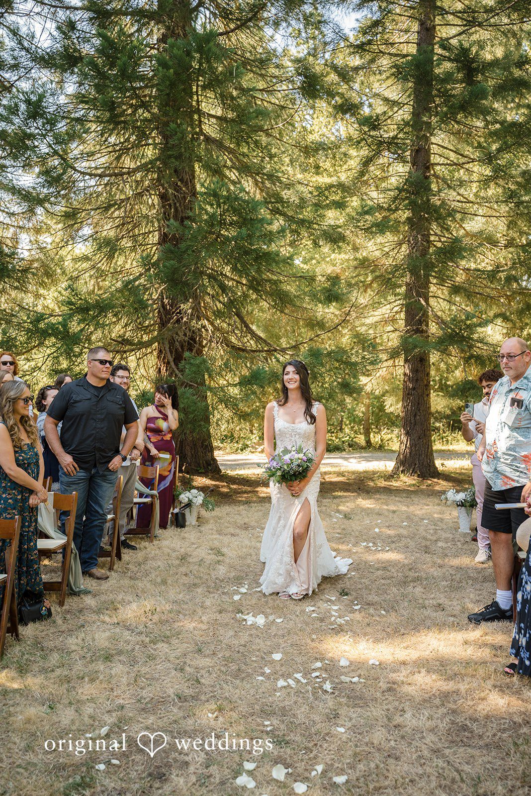 Nikkole + Grant The bride walks down the aisle