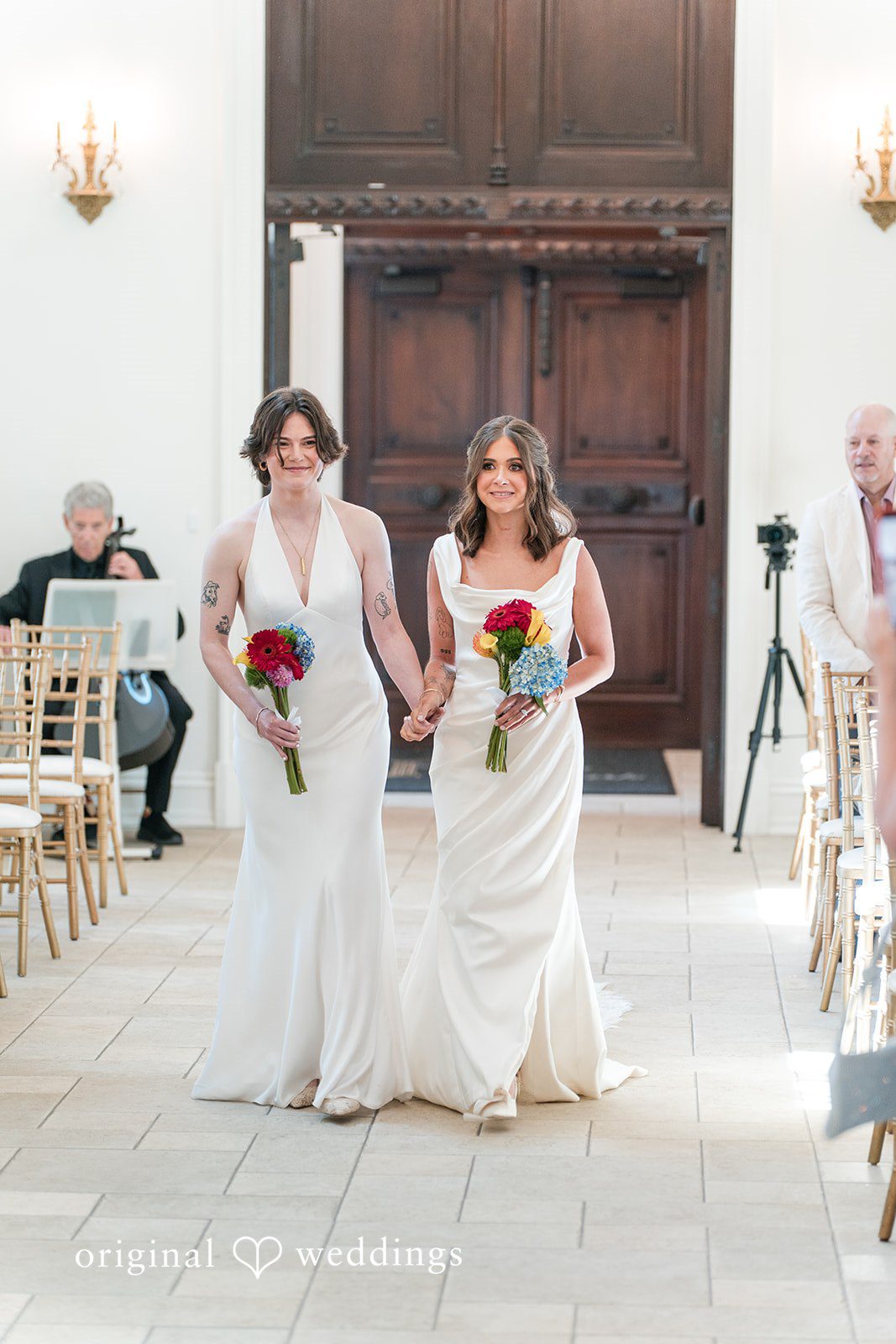 Couple walking down a hallway during a wedding event.
