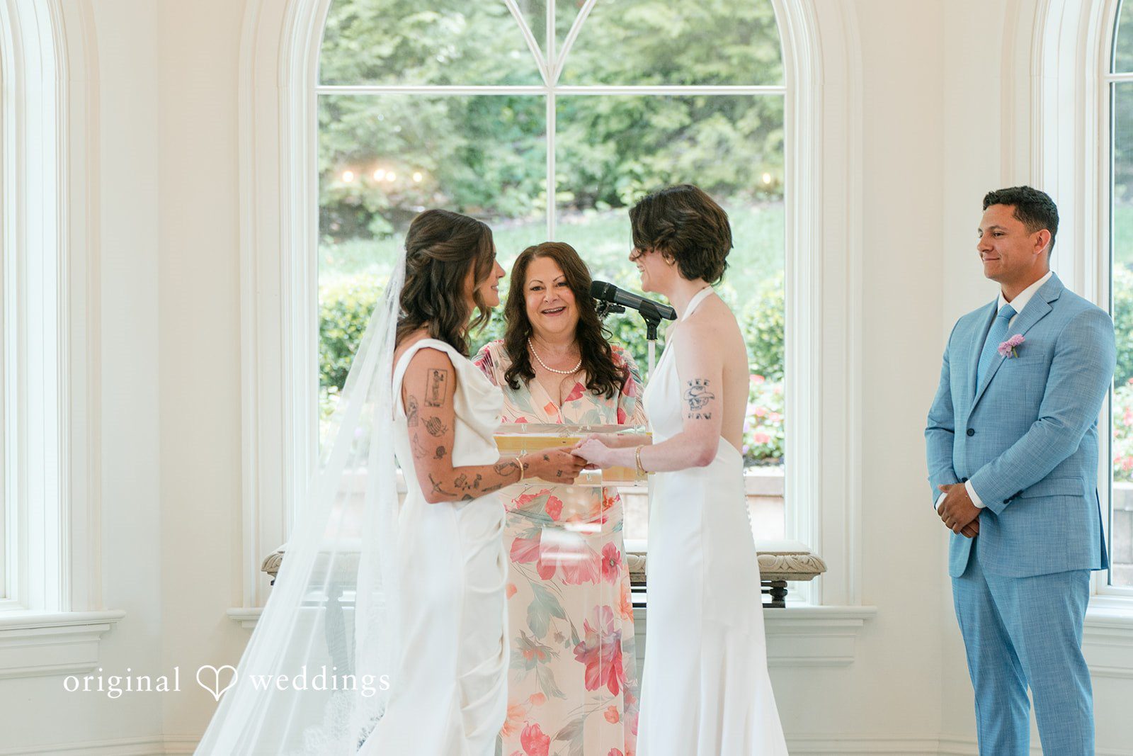 A wedding party standing together during the ceremony service.