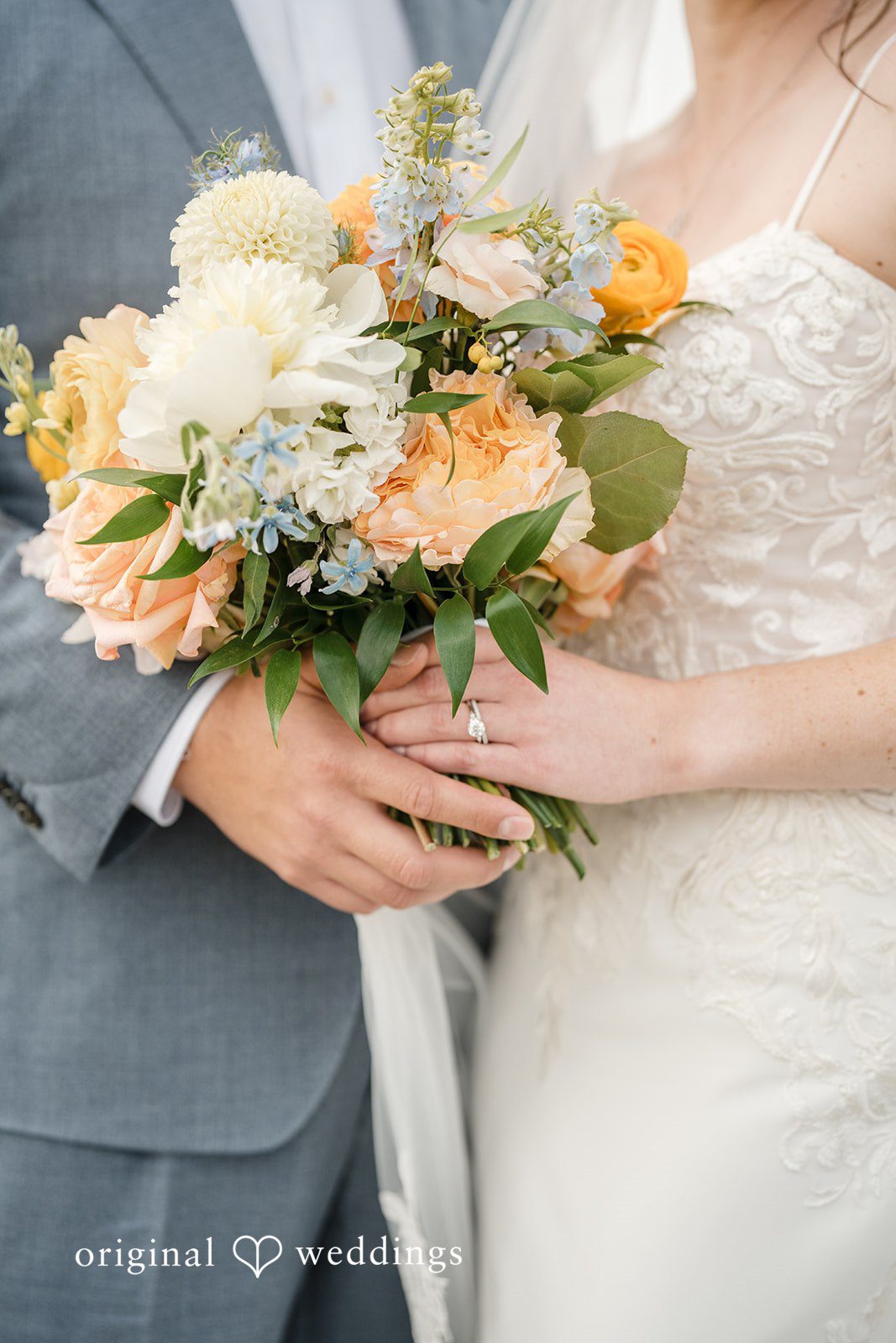 Daniel + Karen A close-up of a bride holding a bouquet of flowers while standing next to the groom.