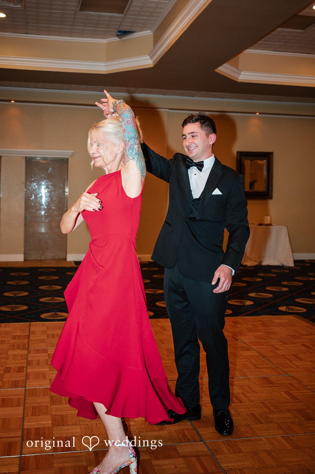 The groom dances with his mother