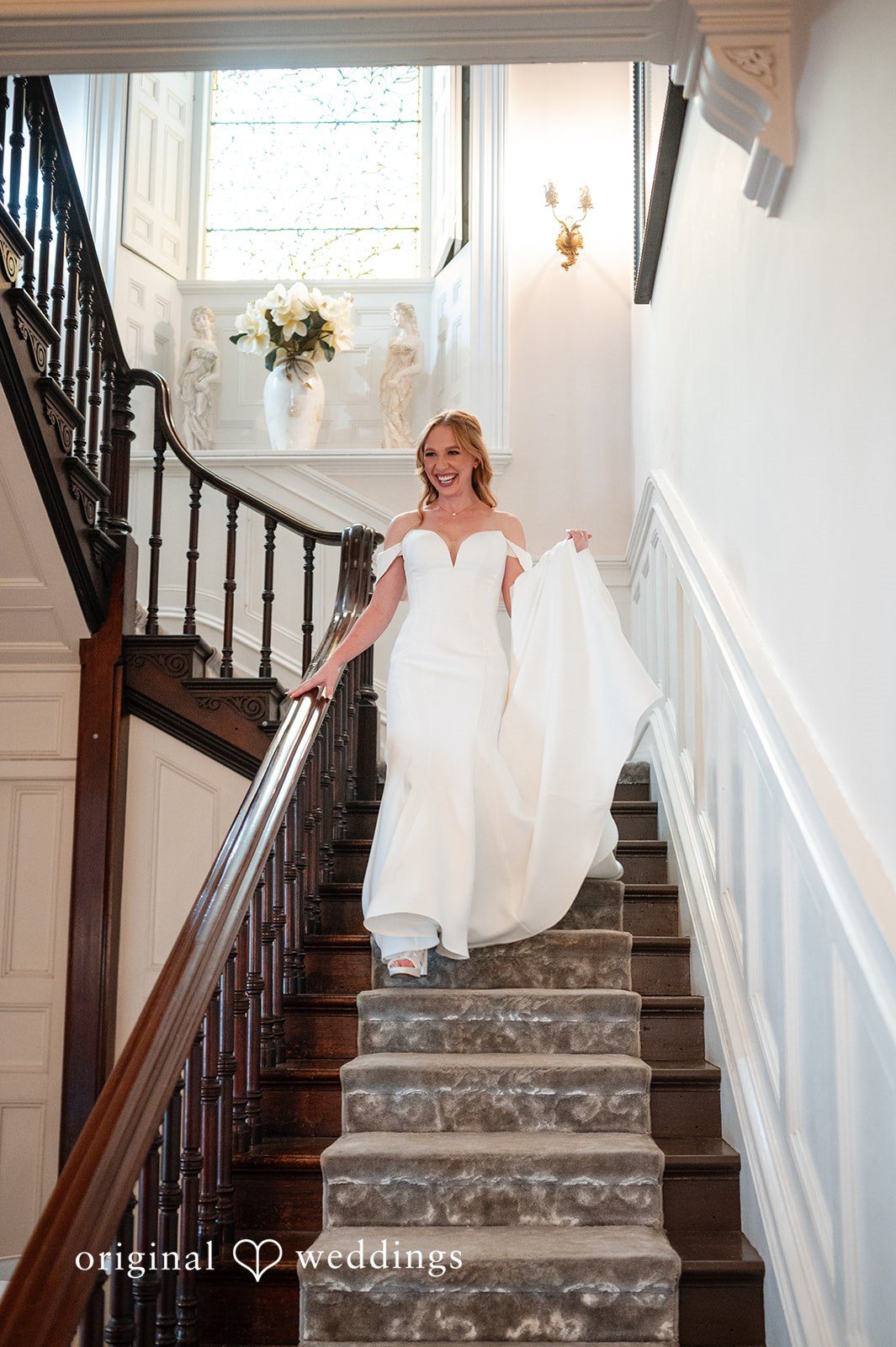 The bride descends the stairs magnificently