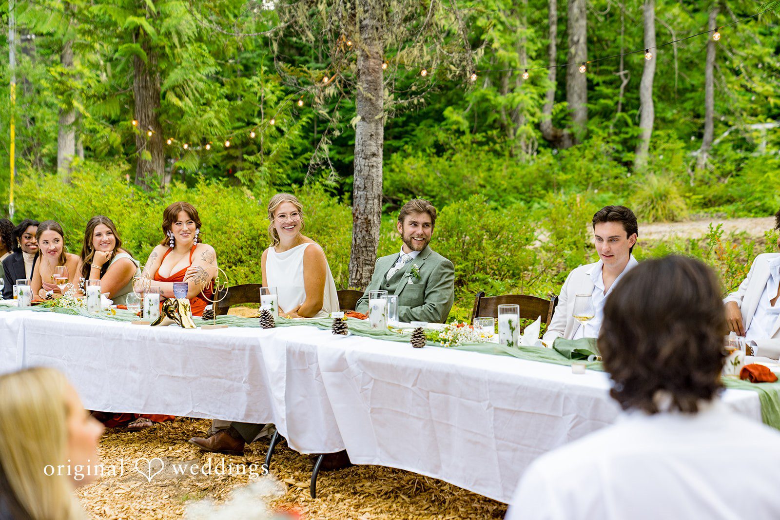 Abigail + Reece Wedding guests seated at a long table during a reception dinner.