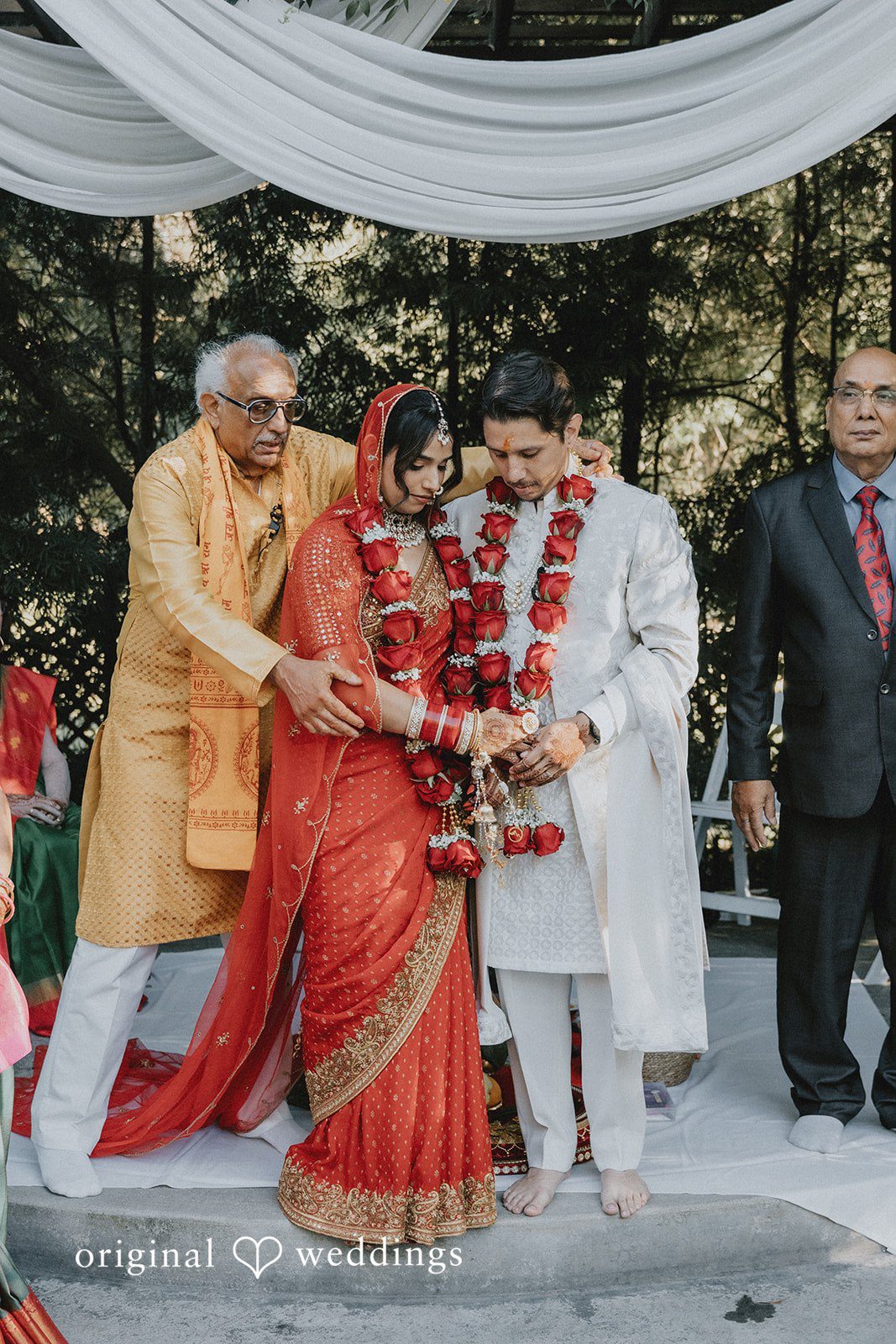 Guests gathered around during a traditional Indian wedding ritual.