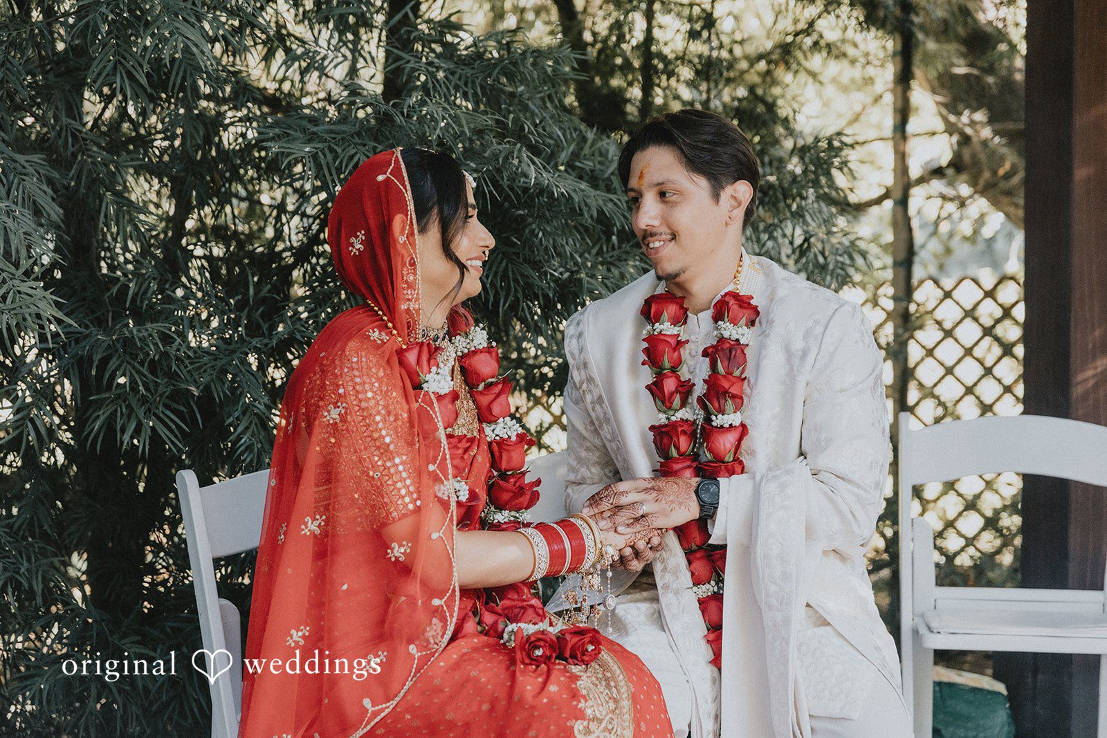 A bride and groom facing each other during a ceremony.
