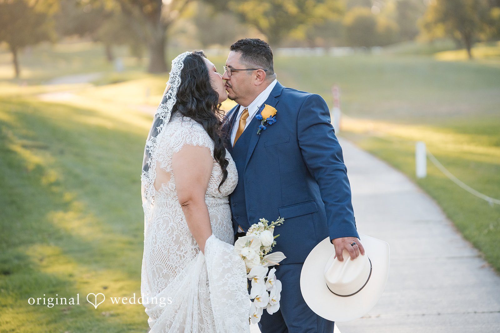 A bride and groom kissing each other at Rio Hondo by Wedgewood Weddings.