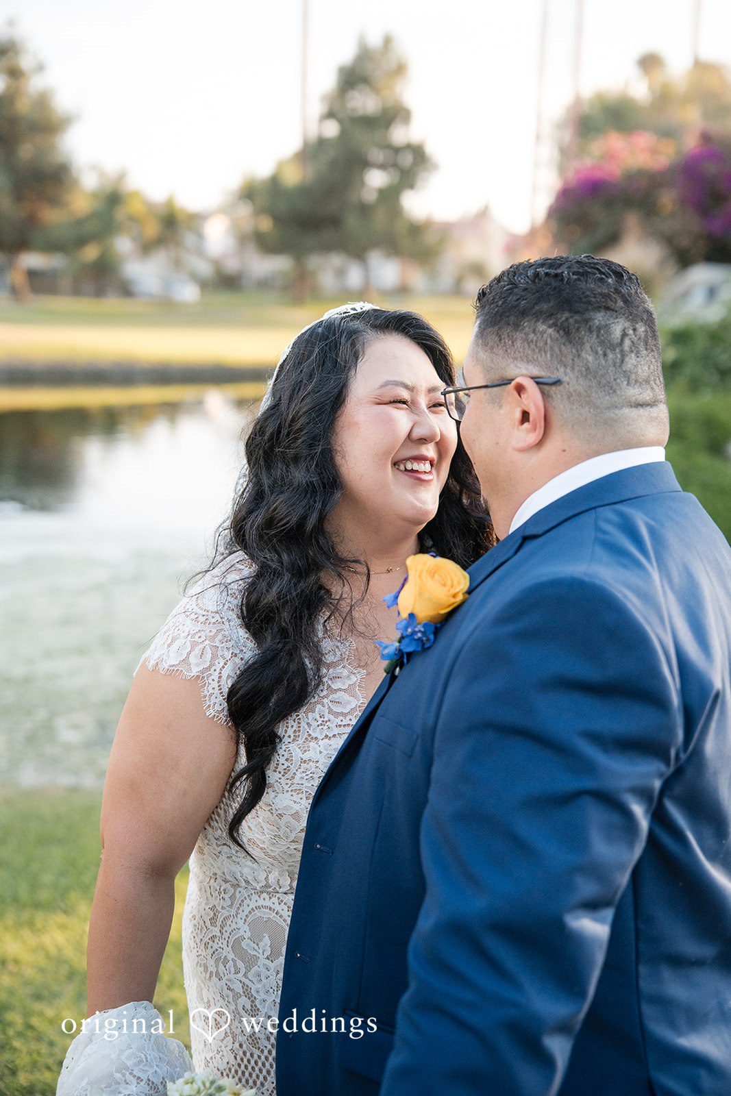 A close-up shot of a bride and groom embracing lovingly.