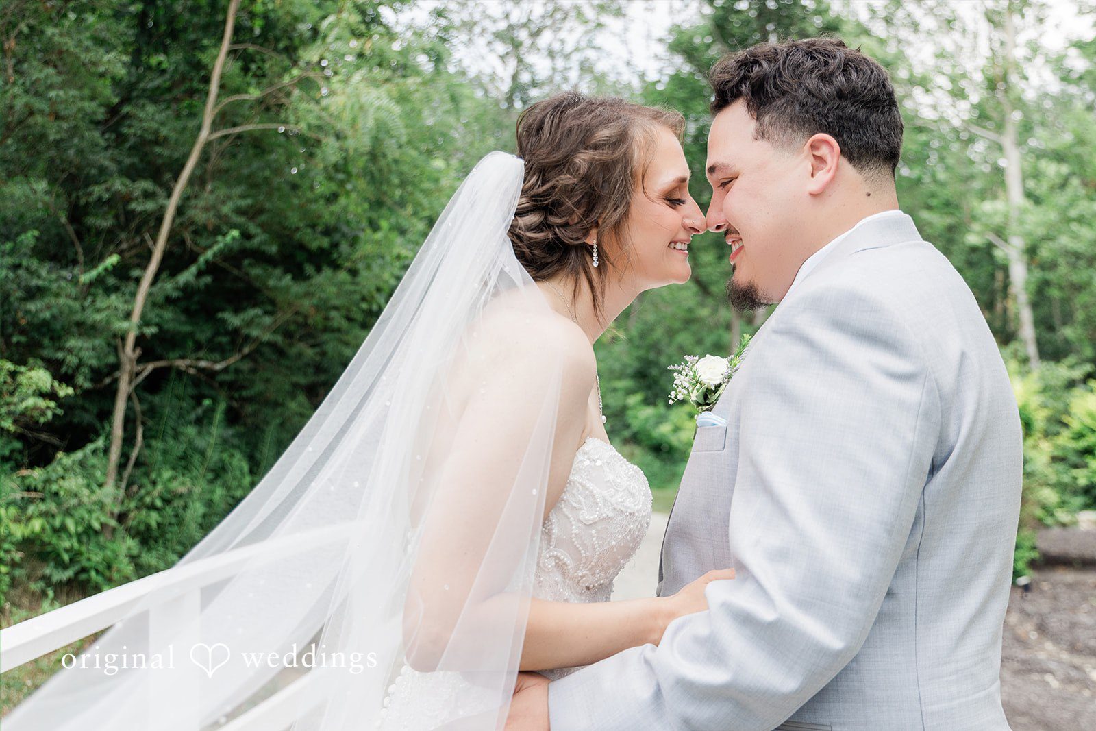 Alexander + Annalisse A bride and groom look affectionately into each other's eyes while standing close together.