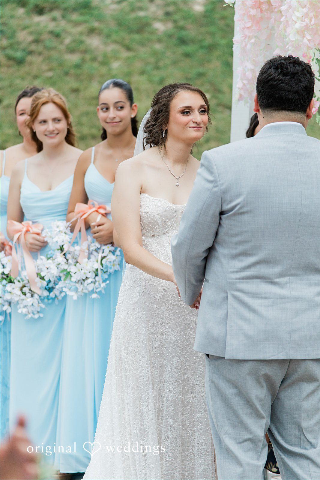 Alexander + Annalisse A bride and groom standing together during their wedding ceremony.