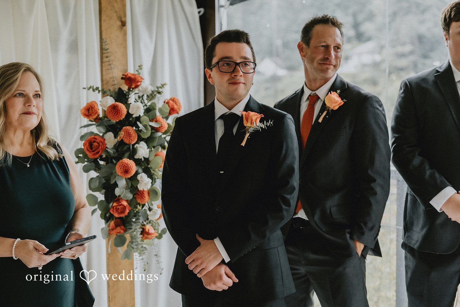 A groom standing with his groomsmen ahead of a wedding ceremony.