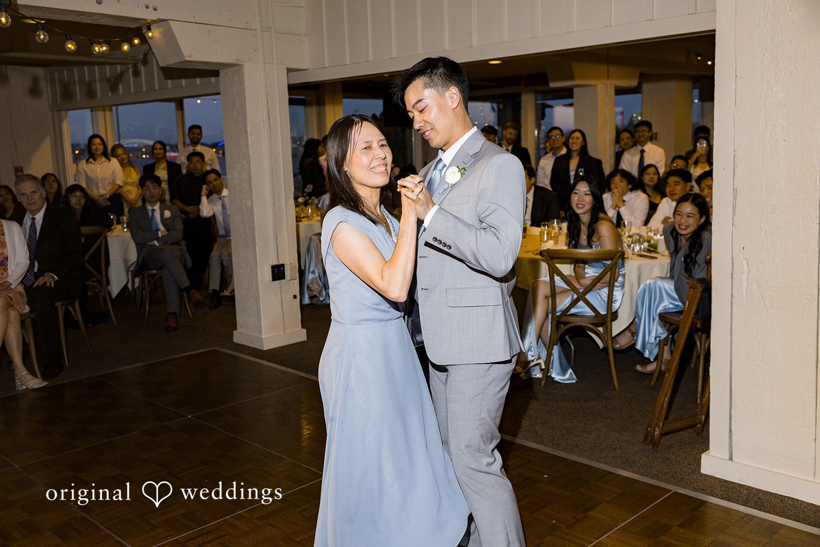 Emily + Paul A women and groom dancing together happily during their wedding reception.