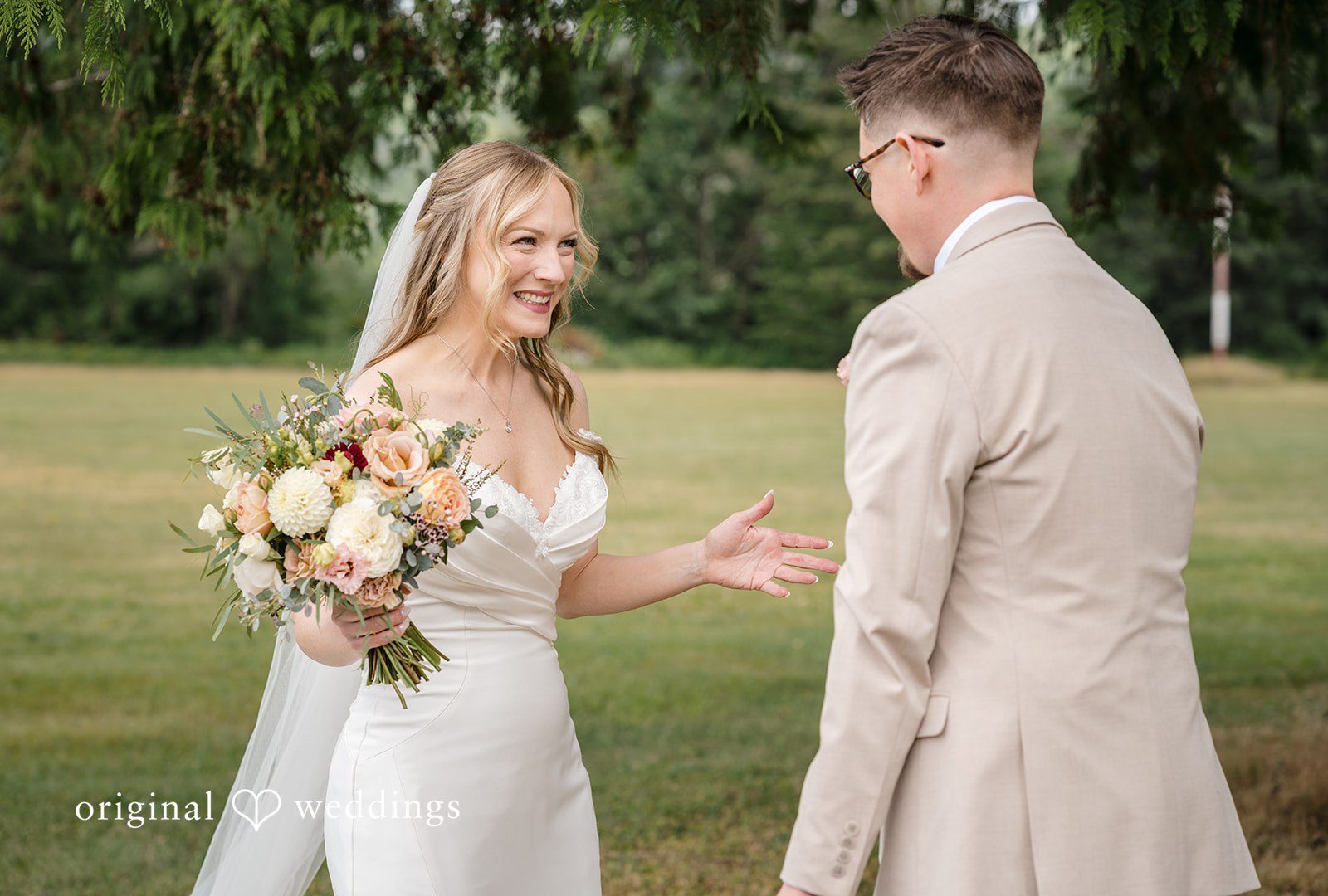 A bride and groom holding hands and facing each other at the altar.