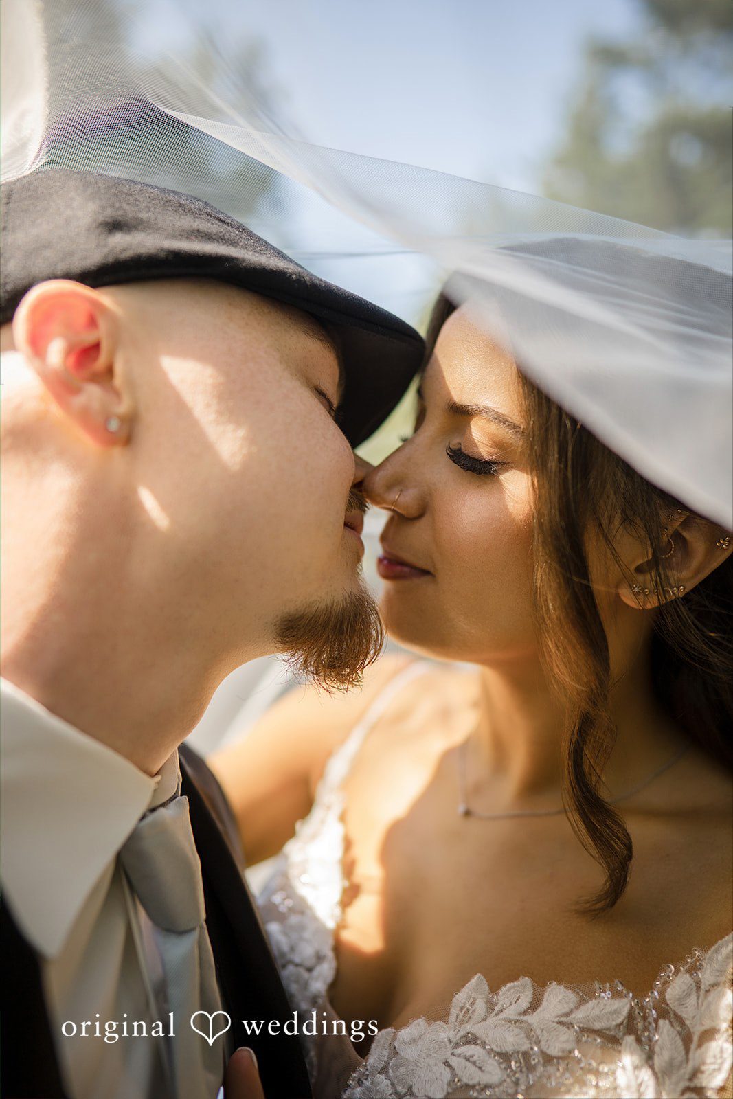 Jade + Nicholas A close-up portrait of a bride and groom about to share a kiss.