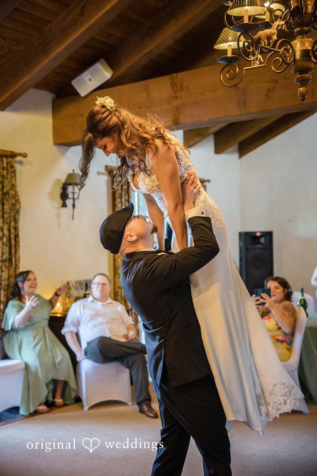 Jade + Nicholas A groom dipping a bride backward during an enthusiastic dance floor moment.