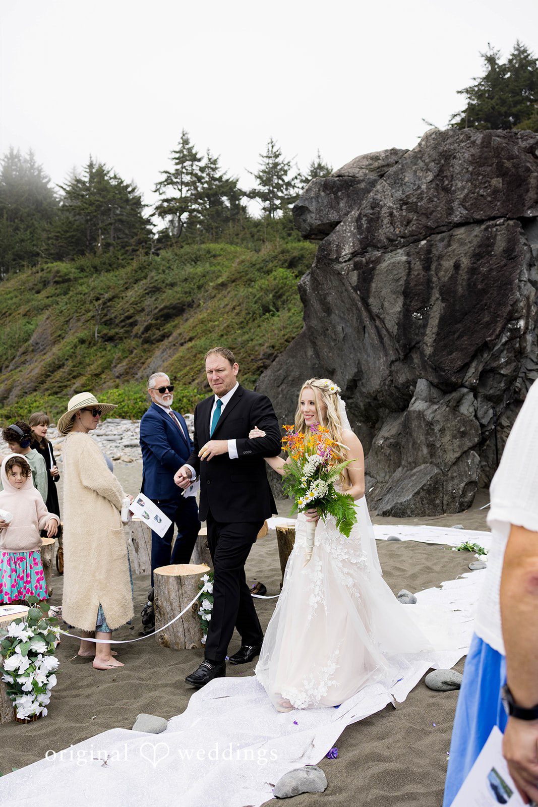 Brittany + Evan The bride's father escorts the bride down the aisle