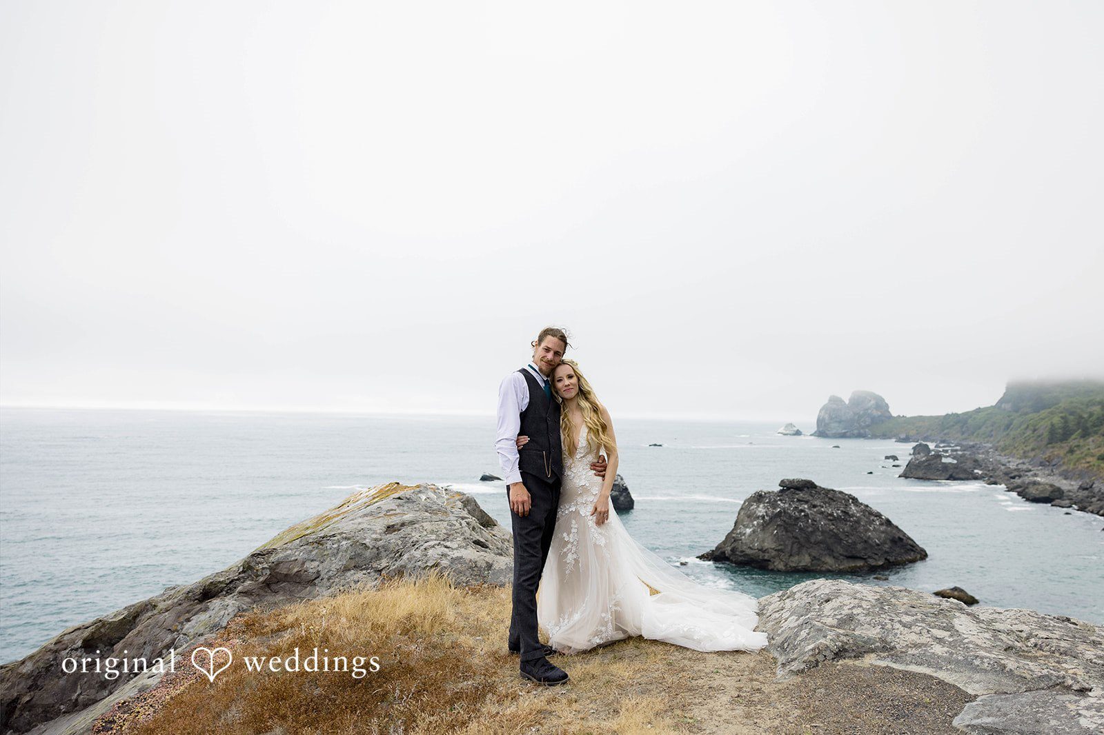 Our Portland wedding photographers at Original Weddings captured a beautiful portrait of the couple by the cliff at the Hidden Beach