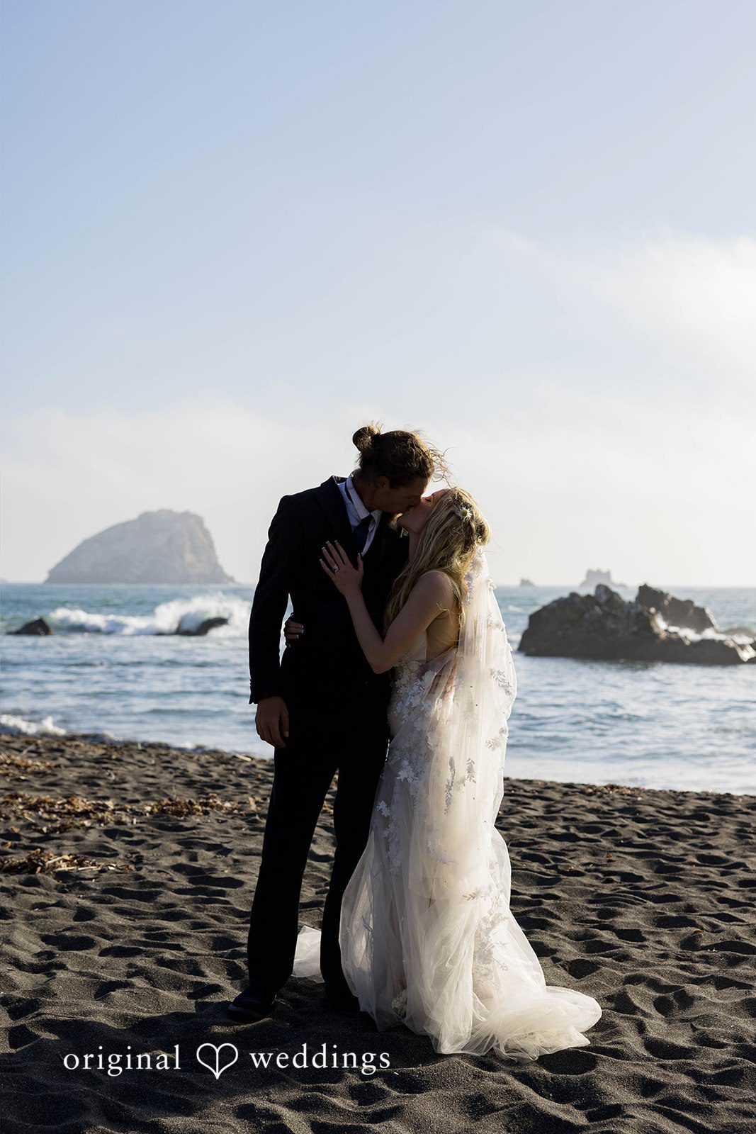 Brittany + Evan The couple takes a deep kiss