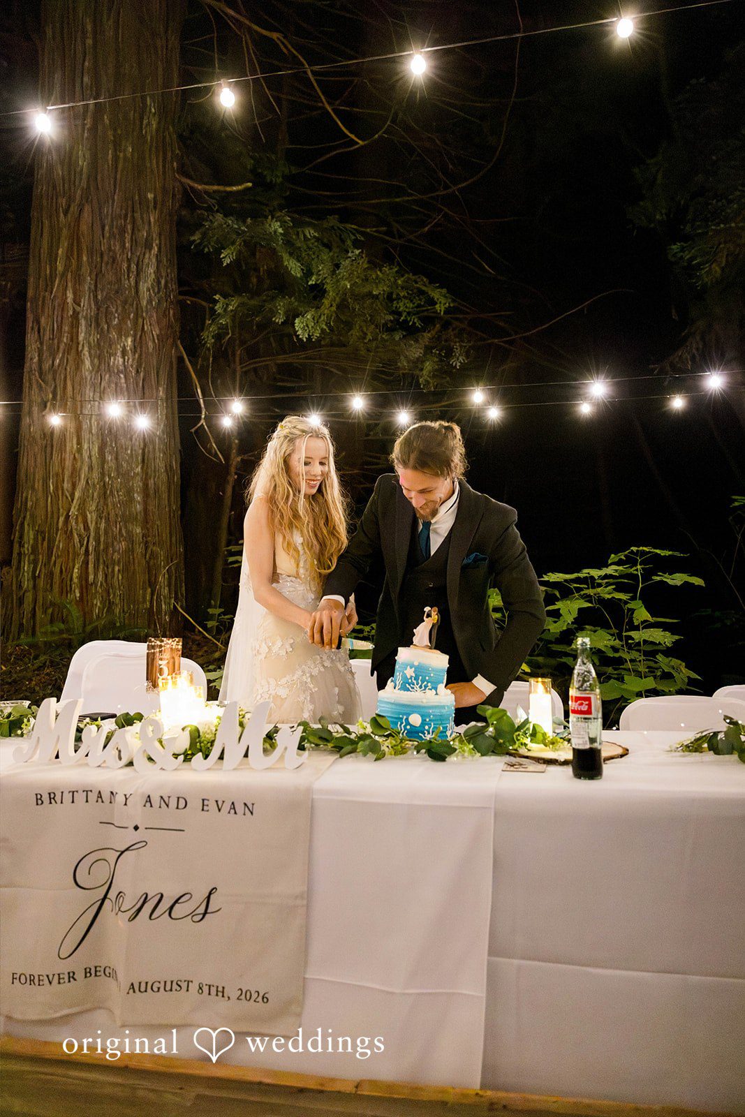 Brittany + Evan The couple cuts their cake