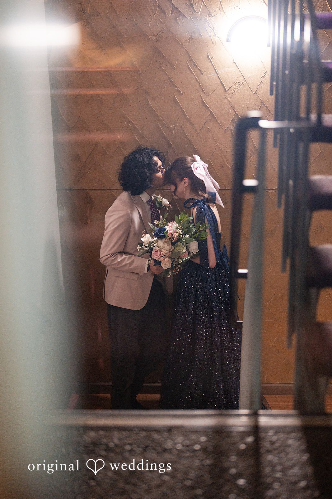 Kshitij + Hannah The groom gives the bride a head kiss