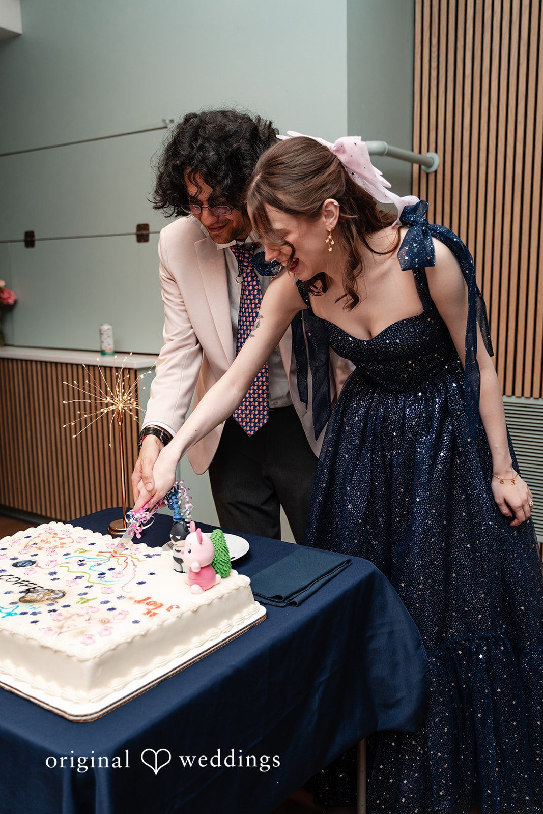 Kshitij + Hannah The couple cuts their wedding cake