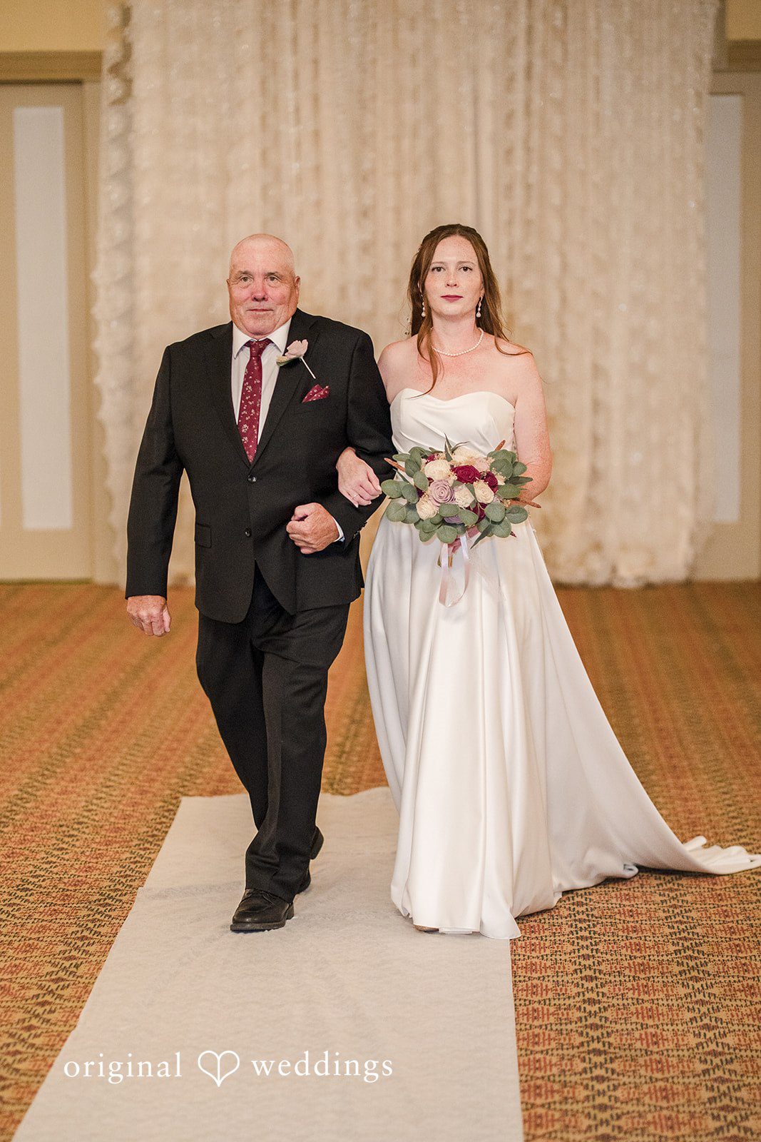 Kimberly + David Bride and man holding hands and walking down the aisle.
