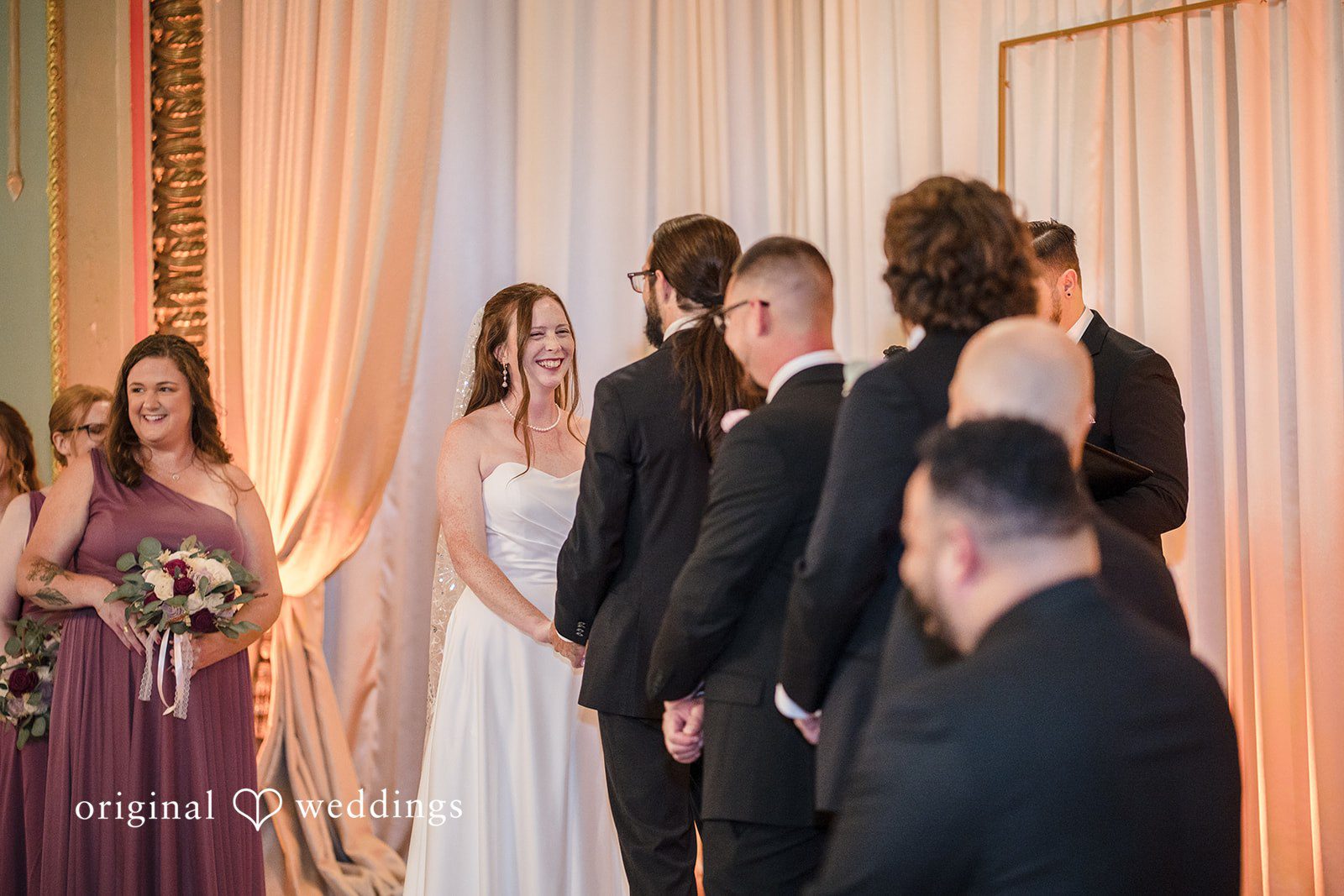 Kimberly + David Wedding party gathered around the altar during the ceremony.