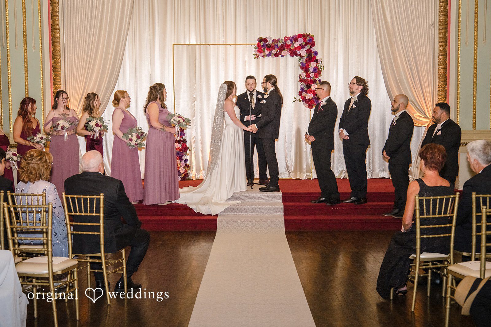 Kimberly + David Full view of the wedding party gathered at the altar.