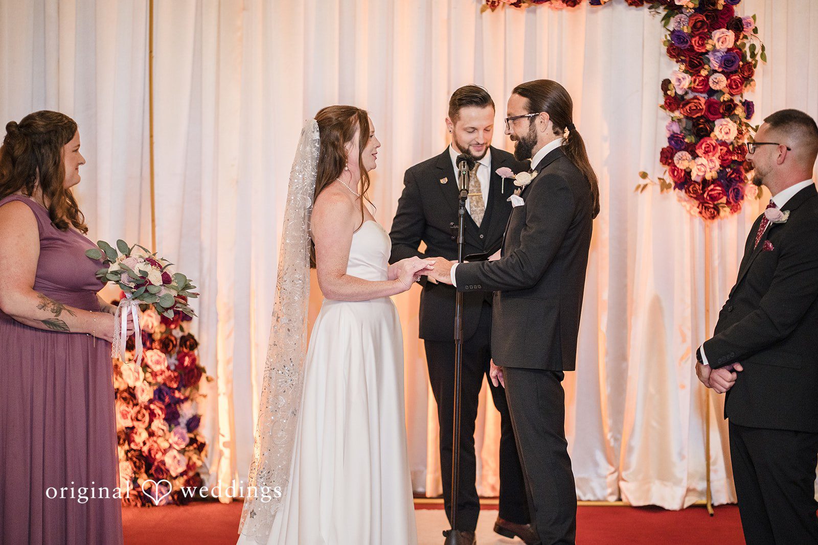 Kimberly + David Bride and groom facing each other to exchange vows.