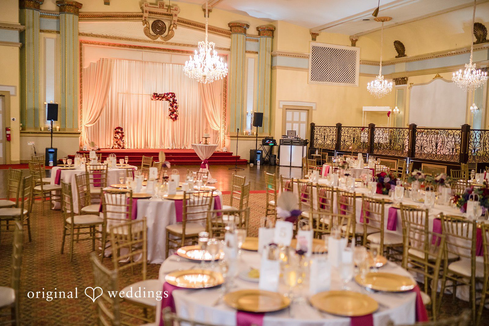 Kimberly + David Long reception table set with gold charger plates and white linens.