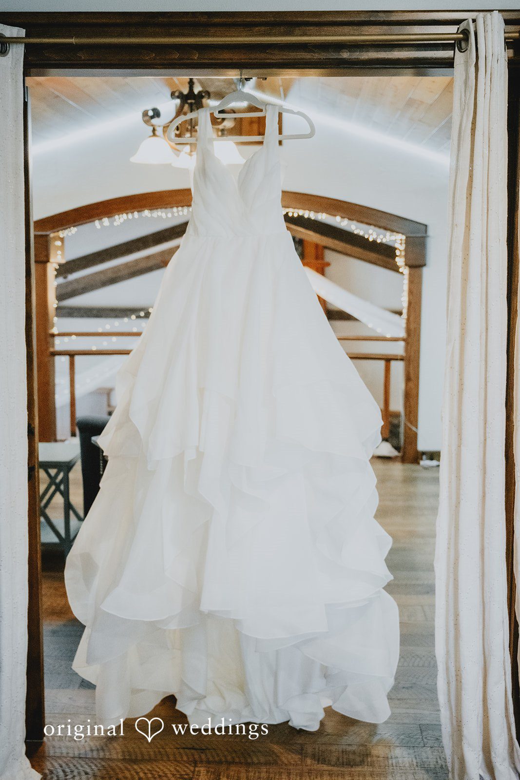 McKenna + Patrick The bride's wedding gown gracefully hanging